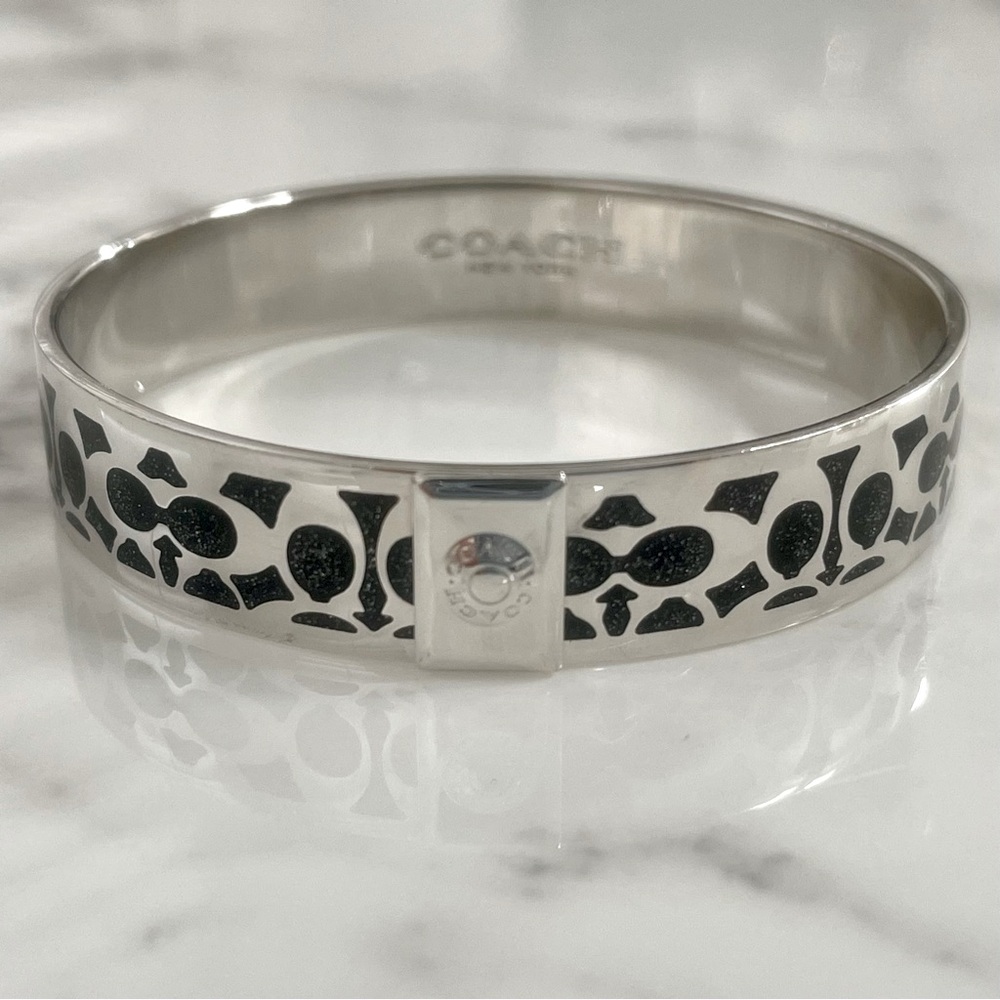 Coach bangle bracelet in black and silver tones
